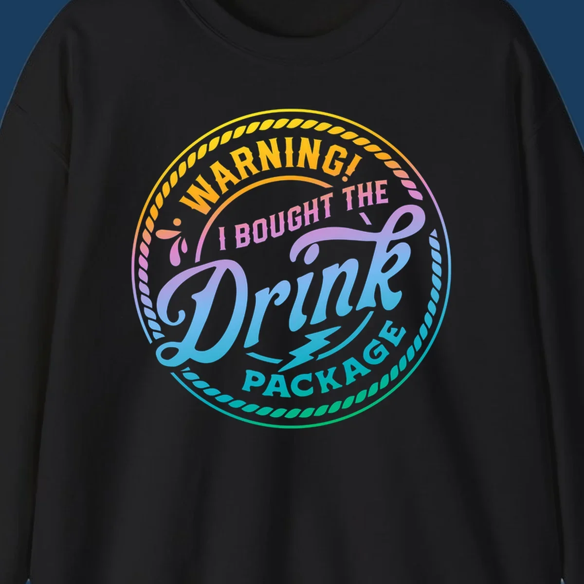 Warning I Bought The Drink Package circular badge design with colorful gradient text.
