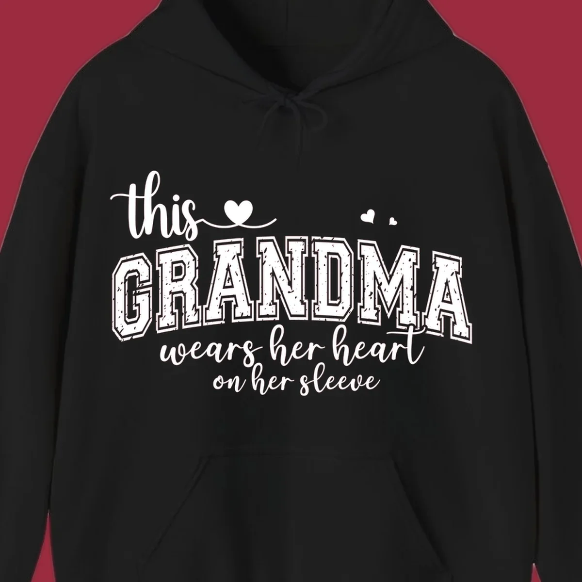 This Grandma Wears Her Heart On Her Sleeve text design with hearts.