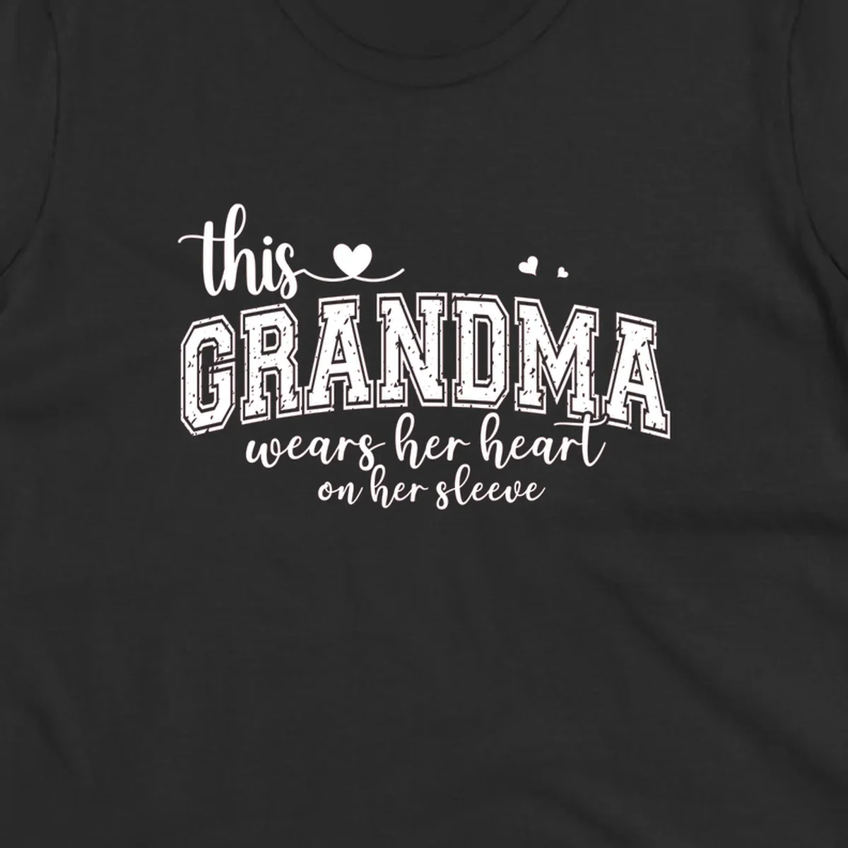 This Grandma Wears Her Heart On Her Sleeve text design with hearts.