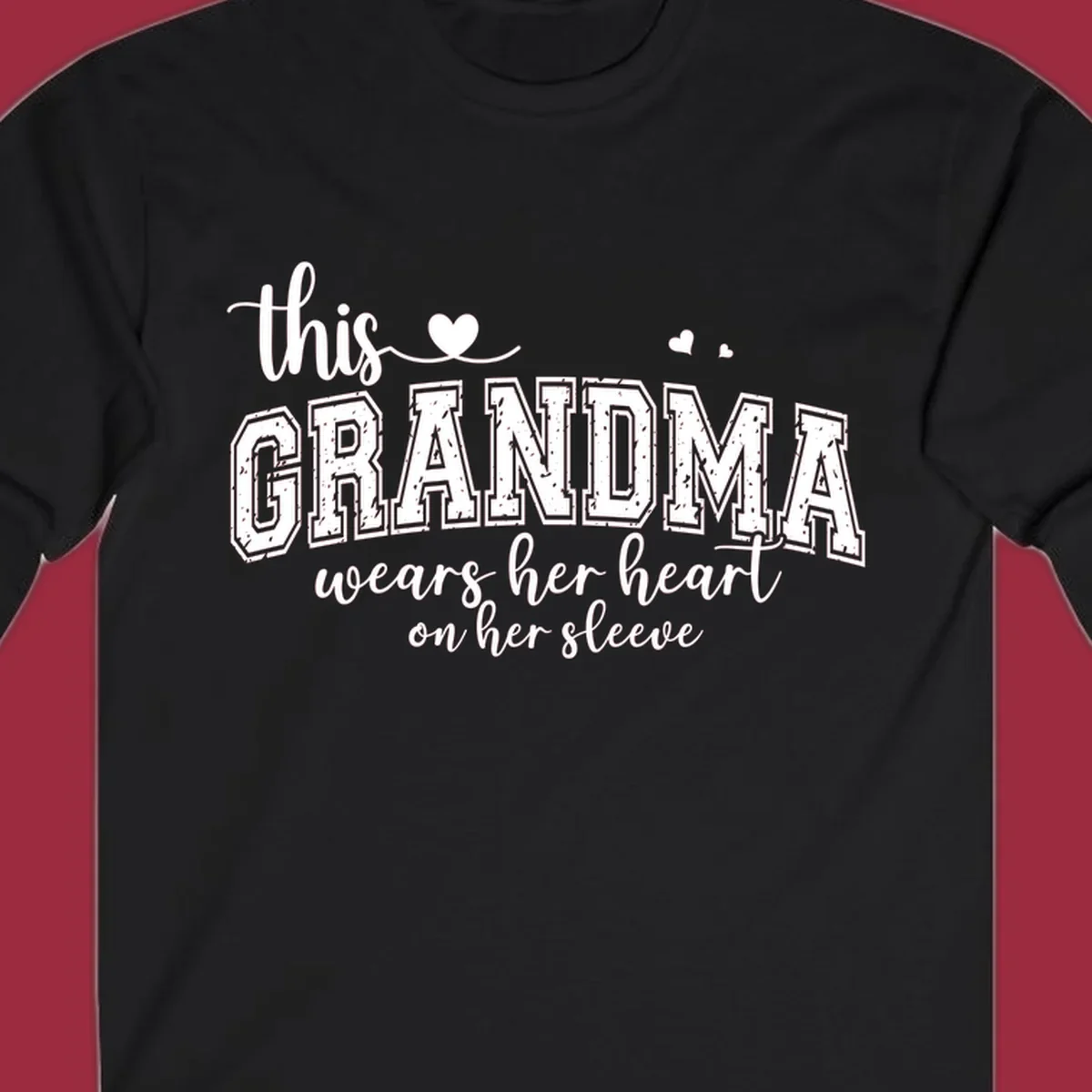 This Grandma Wears Her Heart On Her Sleeve text design with hearts.
