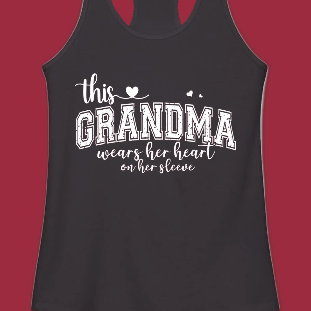 This Grandma Wears Her Heart On Her Sleeve text design with hearts.
