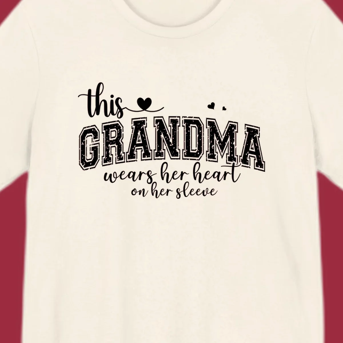 This Grandma Wears Her Heart On Her Sleeve text design with hearts.