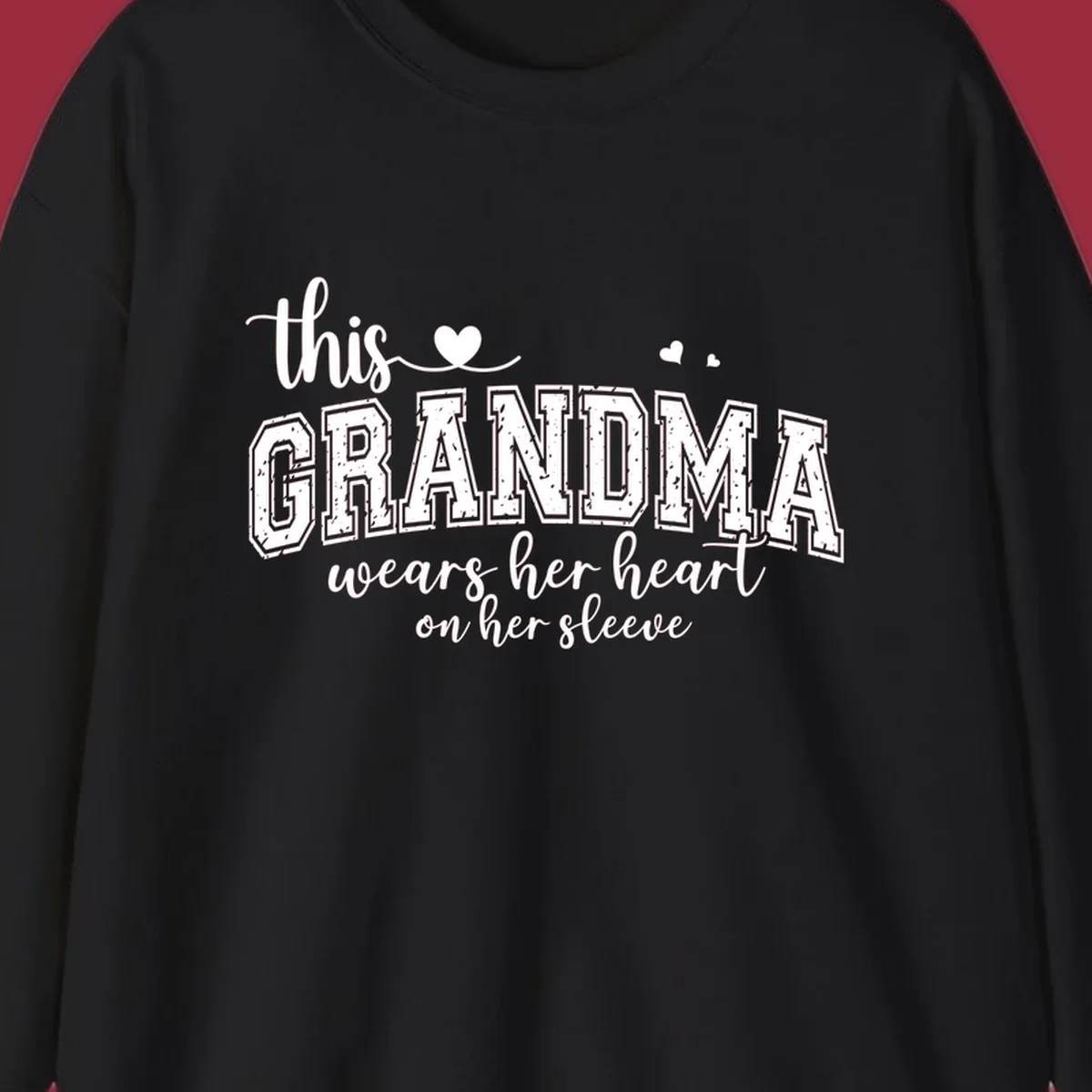 This Grandma Wears Her Heart On Her Sleeve text design with hearts.