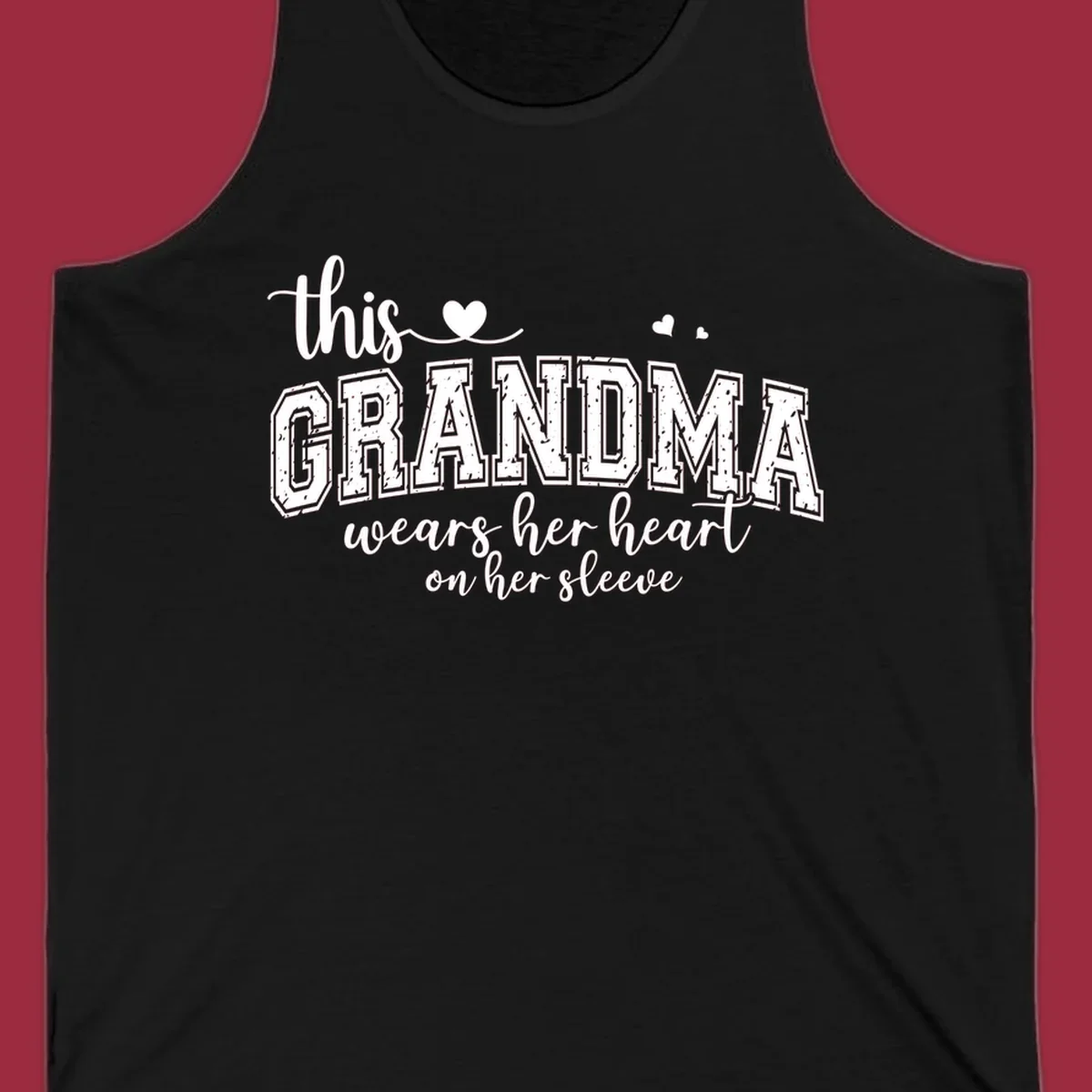This Grandma Wears Her Heart On Her Sleeve text design with hearts.