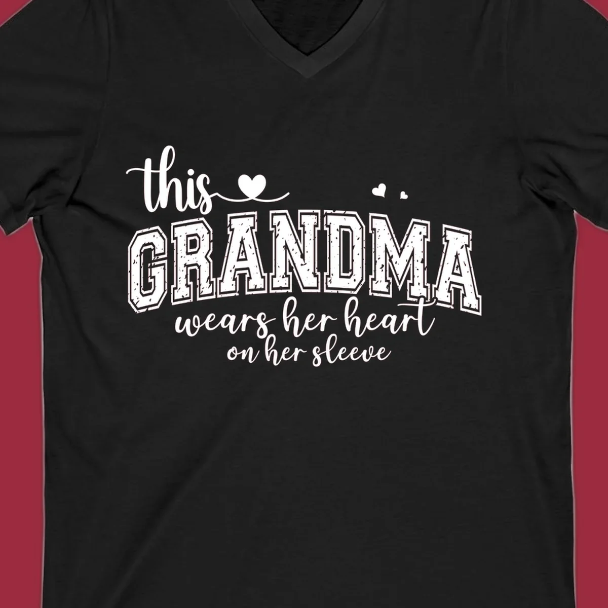 This Grandma Wears Her Heart On Her Sleeve text design with hearts.