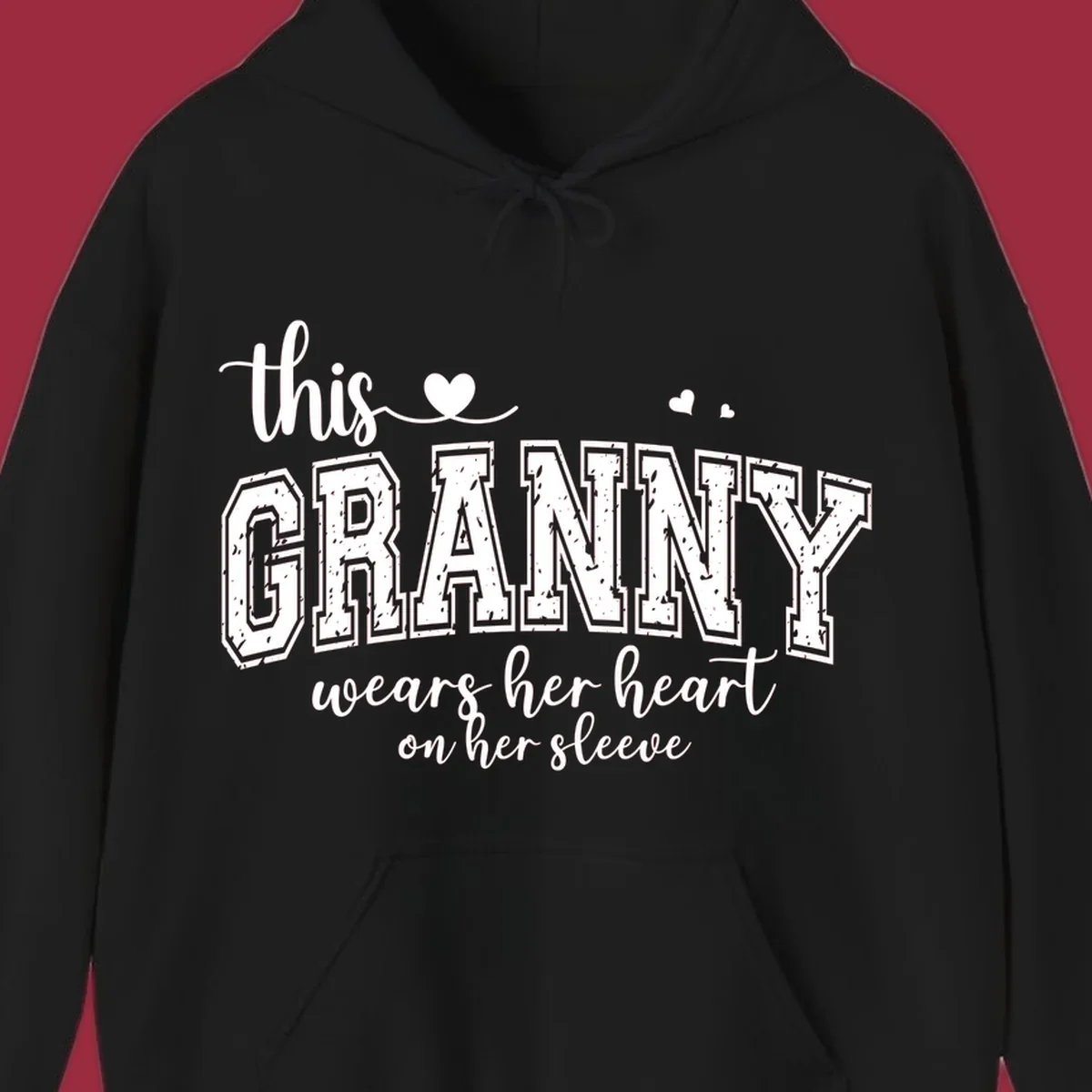 This Granny Wears Her Heart On Her Sleeve text design with heart graphics.