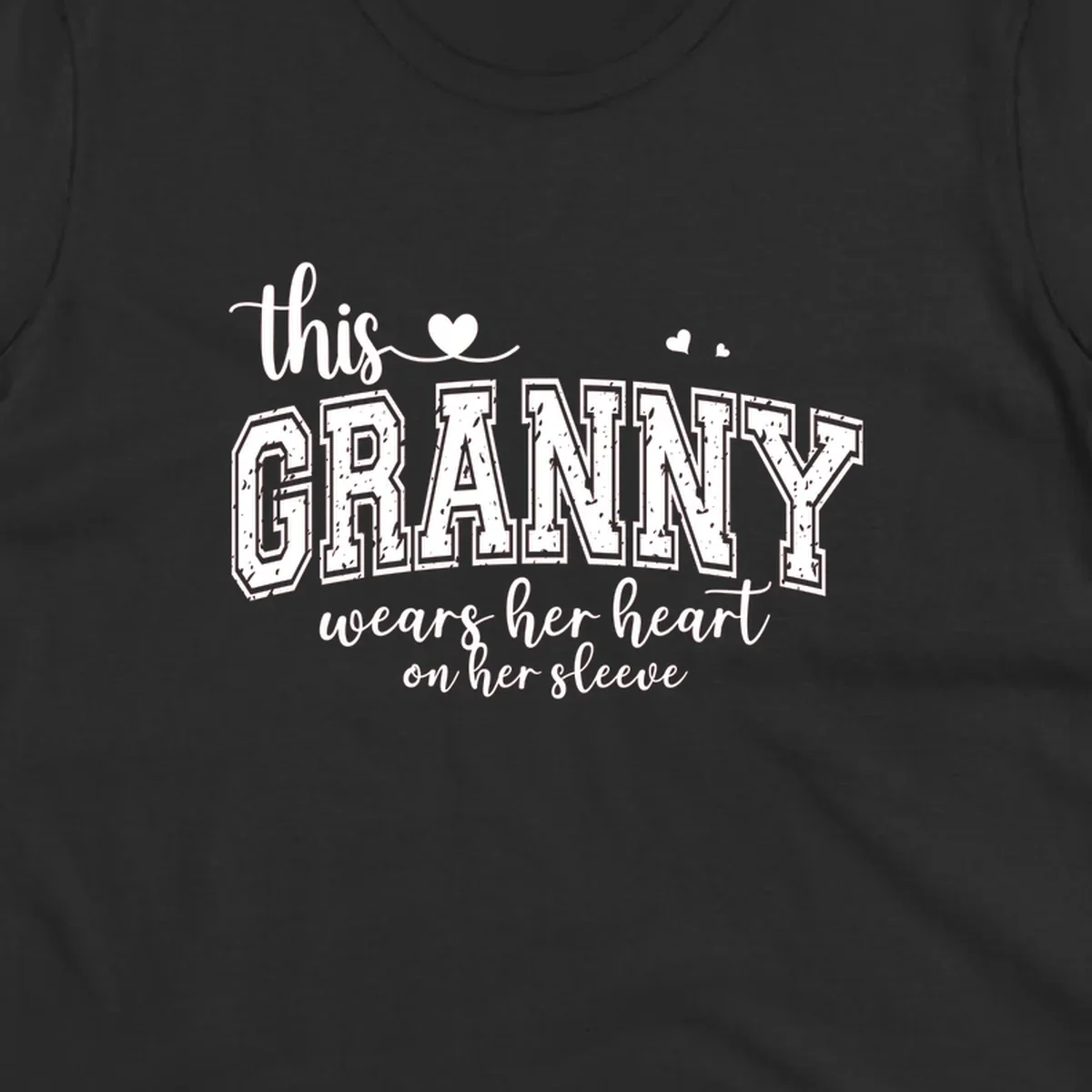 This Granny Wears Her Heart On Her Sleeve text design with heart graphics.