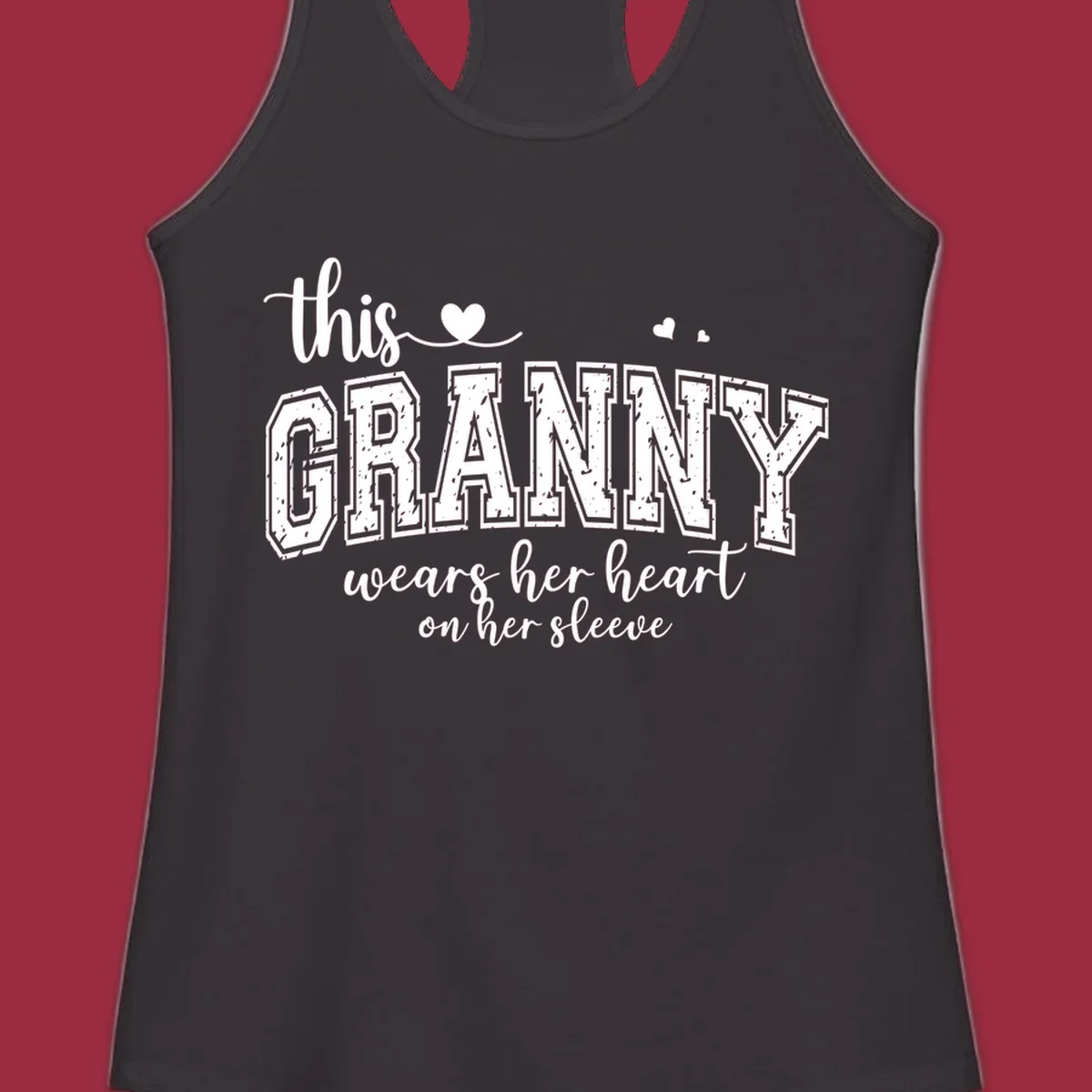 This Granny Wears Her Heart On Her Sleeve text design with heart graphics.