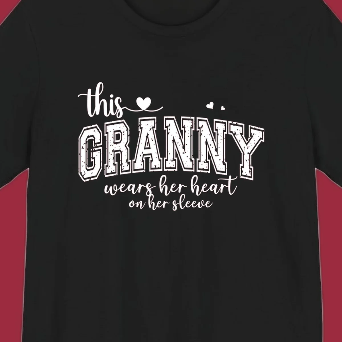 This Granny Wears Her Heart On Her Sleeve text design with heart graphics.