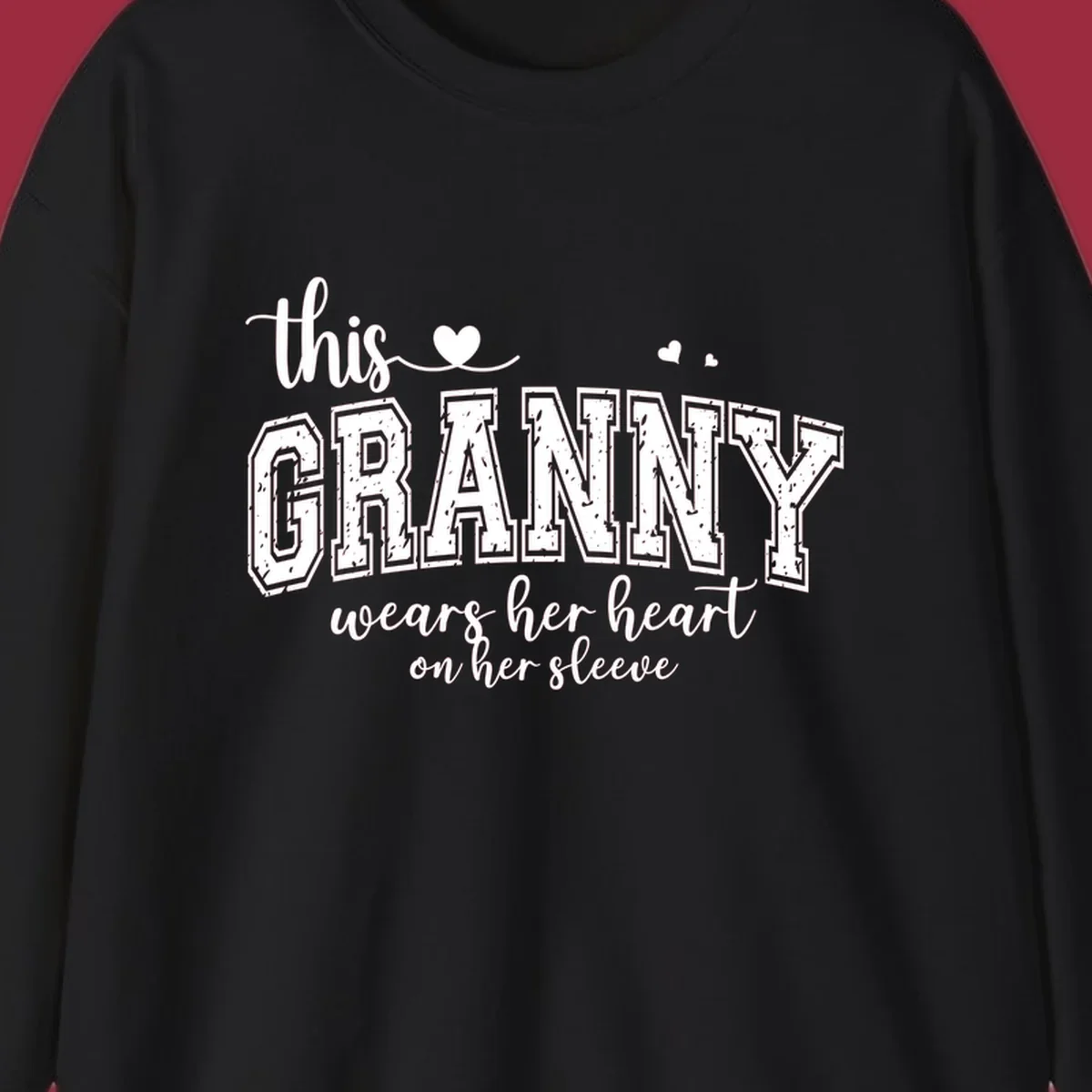 This Granny Wears Her Heart On Her Sleeve text design with heart graphics.