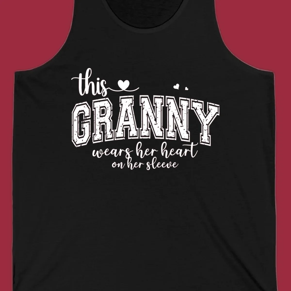 This Granny Wears Her Heart On Her Sleeve text design with heart graphics.