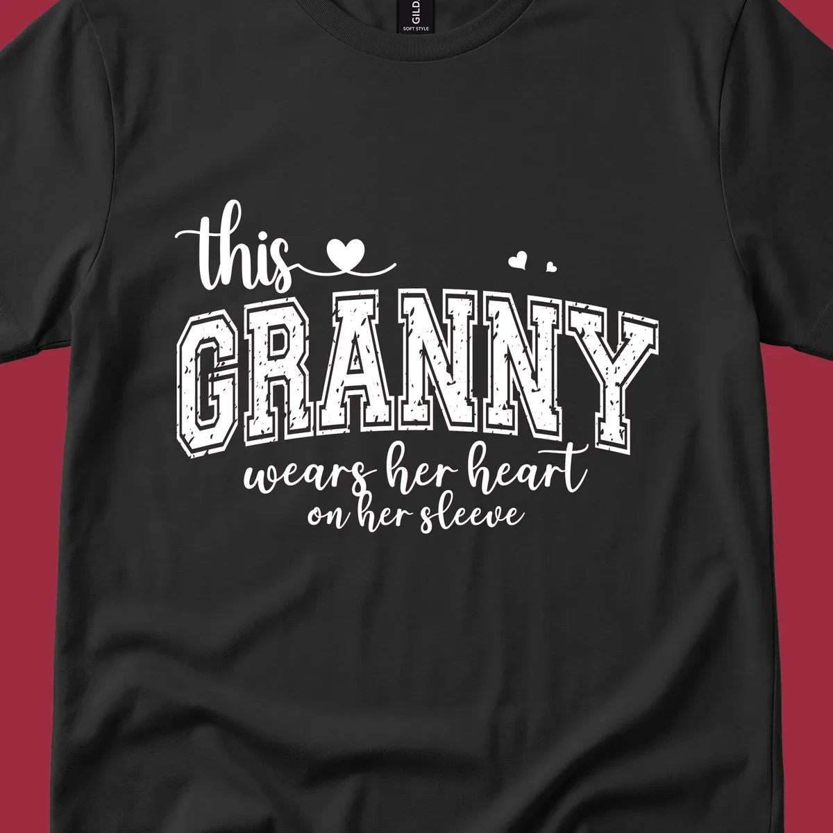This Granny Wears Her Heart On Her Sleeve text design with heart graphics.