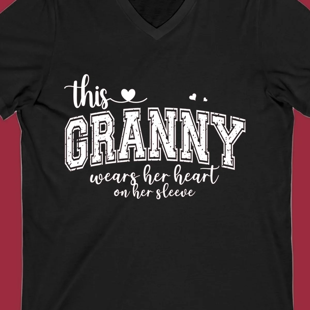 This Granny Wears Her Heart On Her Sleeve text design with heart graphics.