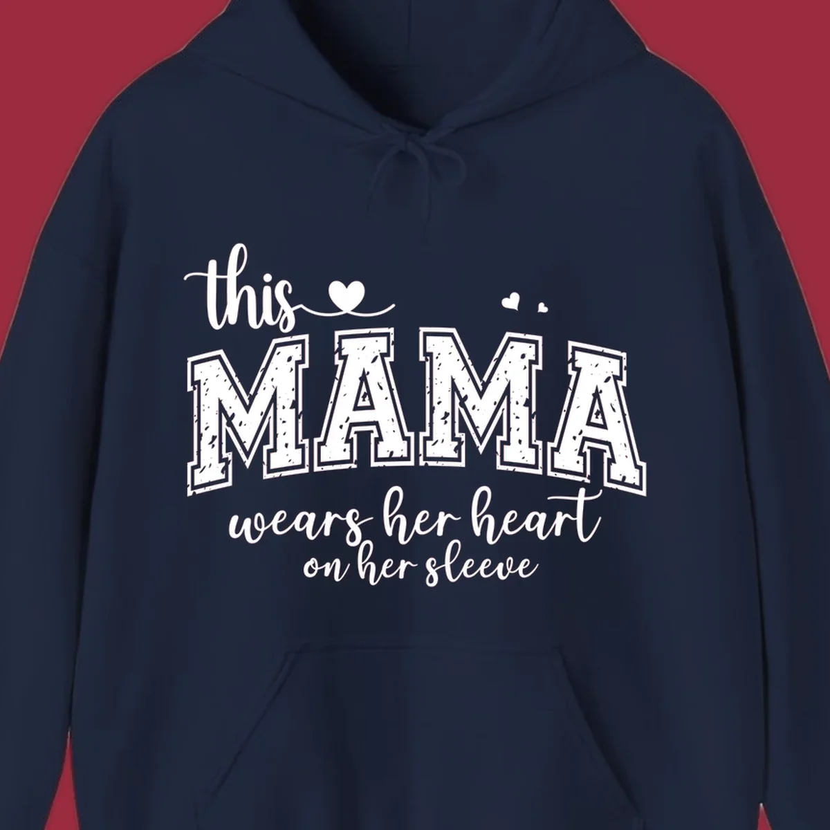 Mama heart on sleeve typography design with script and distressed block text and heart accents.