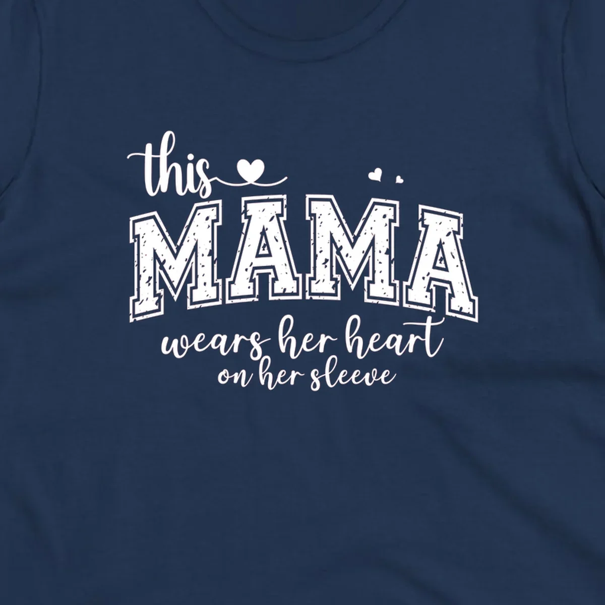 Mama heart on sleeve typography design with script and distressed block text and heart accents.