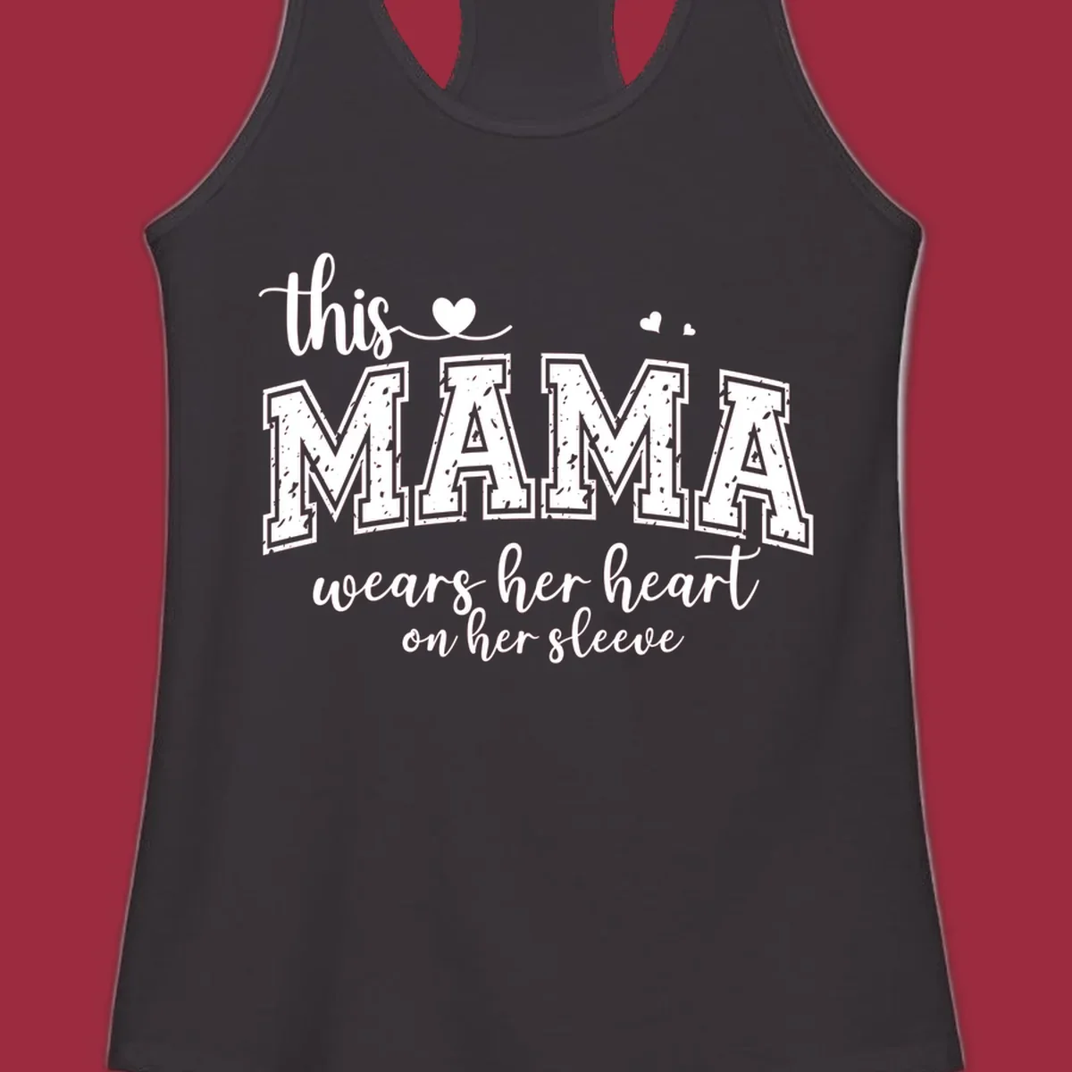 Mama heart on sleeve typography design with script and distressed block text and heart accents.