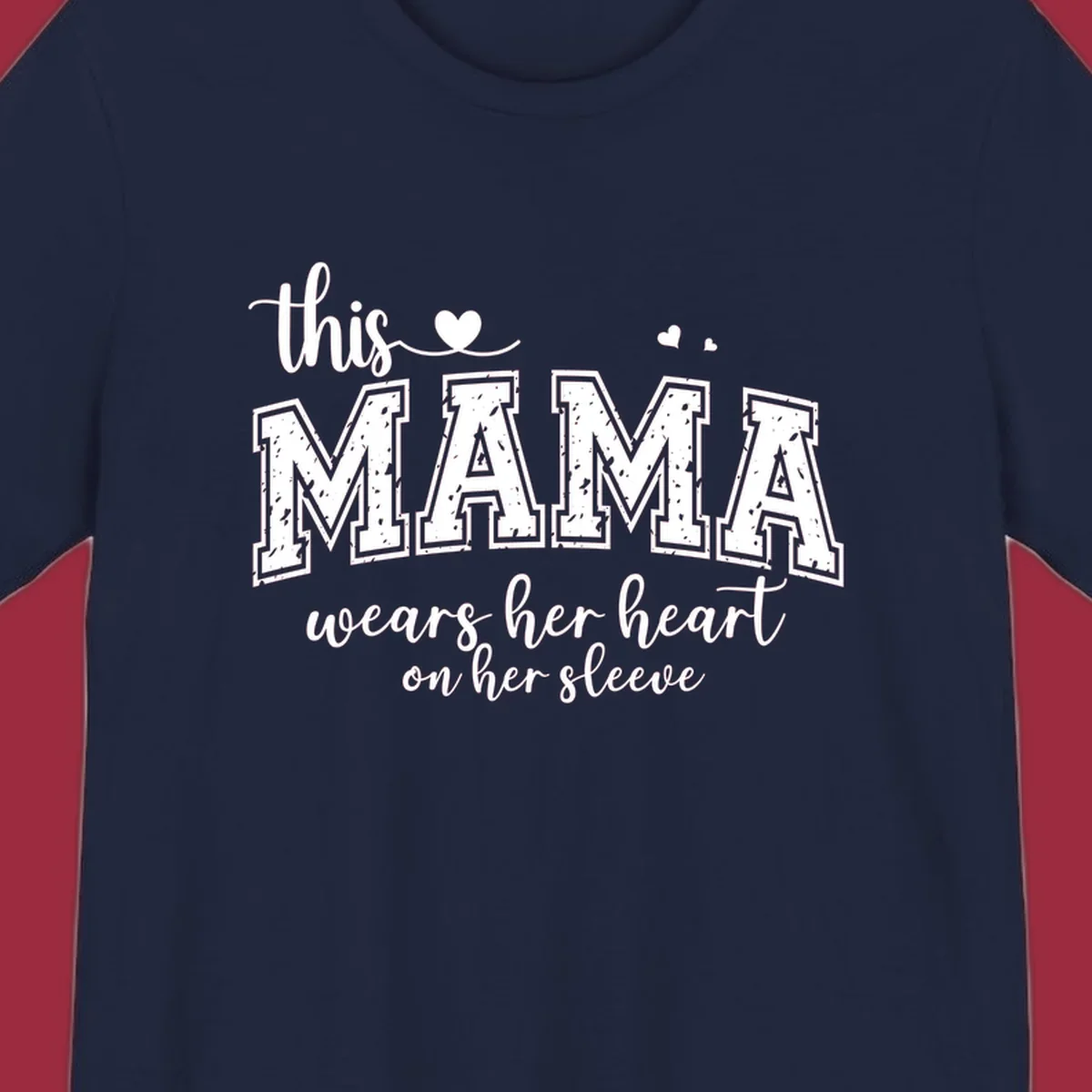 Mama heart on sleeve typography design with script and distressed block text and heart accents.