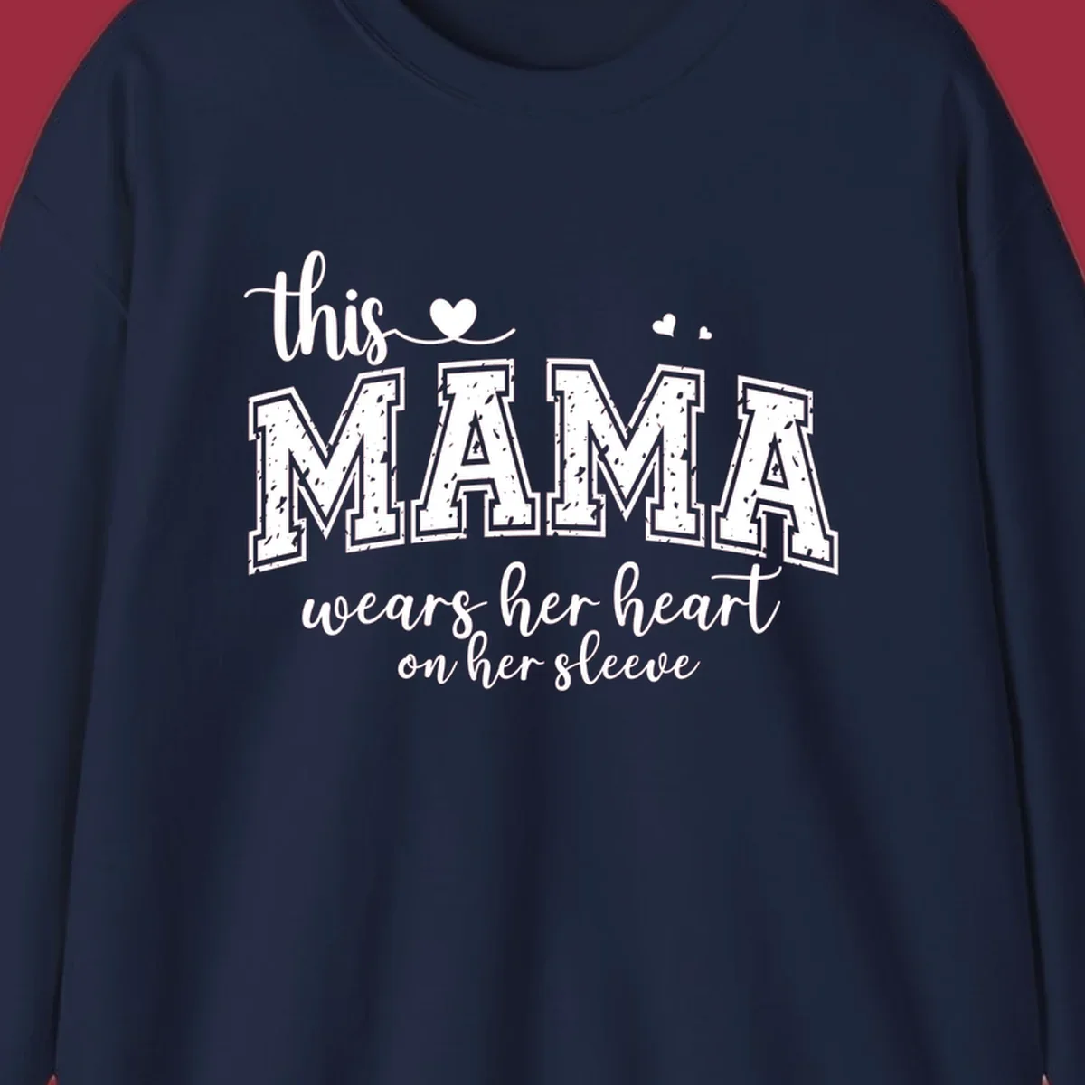 Mama heart on sleeve typography design with script and distressed block text and heart accents.