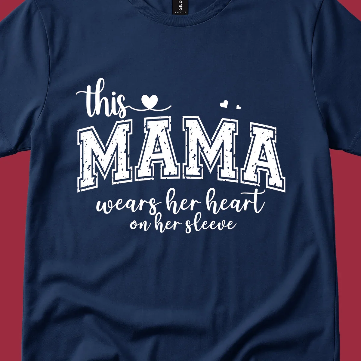 Mama heart on sleeve typography design with script and distressed block text and heart accents.