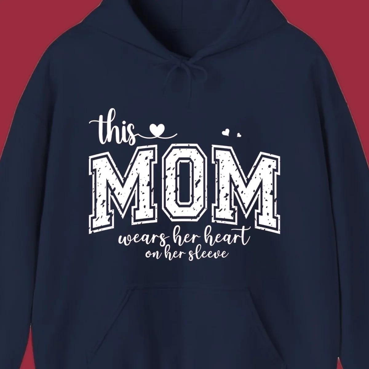 This mom wears her heart on her sleeve graphic with distressed text and heart icons.