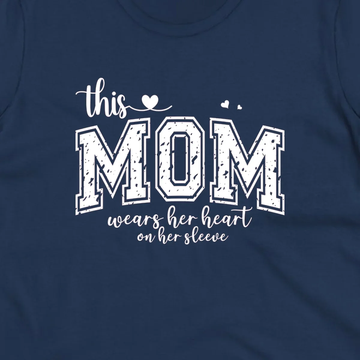 This mom wears her heart on her sleeve graphic with distressed text and heart icons.