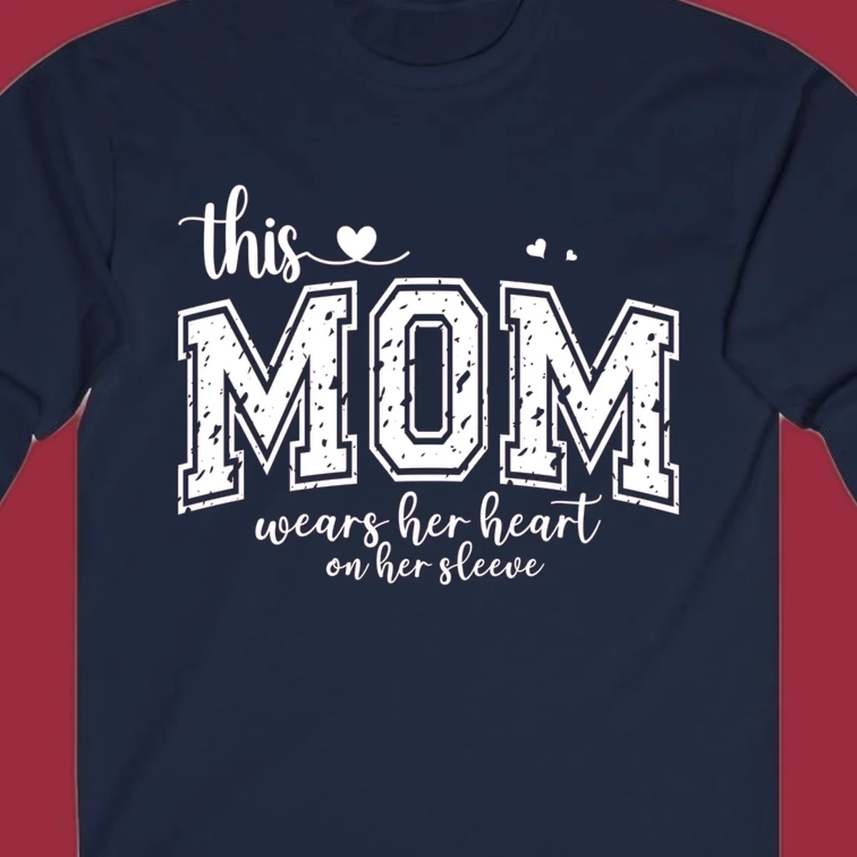 This mom wears her heart on her sleeve graphic with distressed text and heart icons.