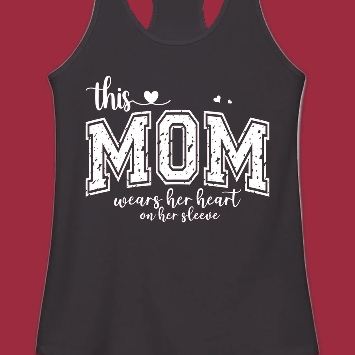 This mom wears her heart on her sleeve graphic with distressed text and heart icons.