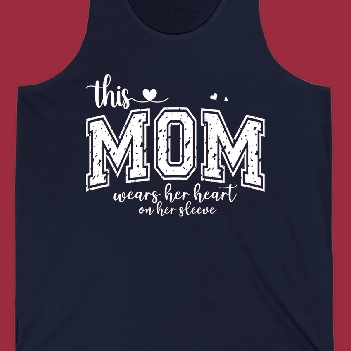 This mom wears her heart on her sleeve graphic with distressed text and heart icons.