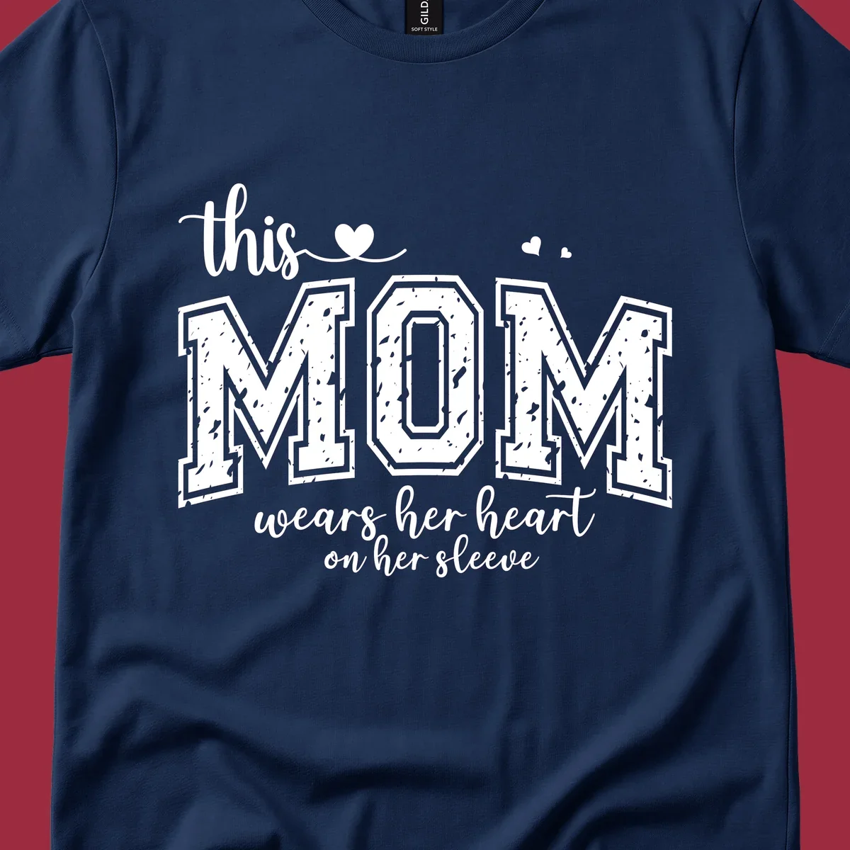 This mom wears her heart on her sleeve graphic with distressed text and heart icons.
