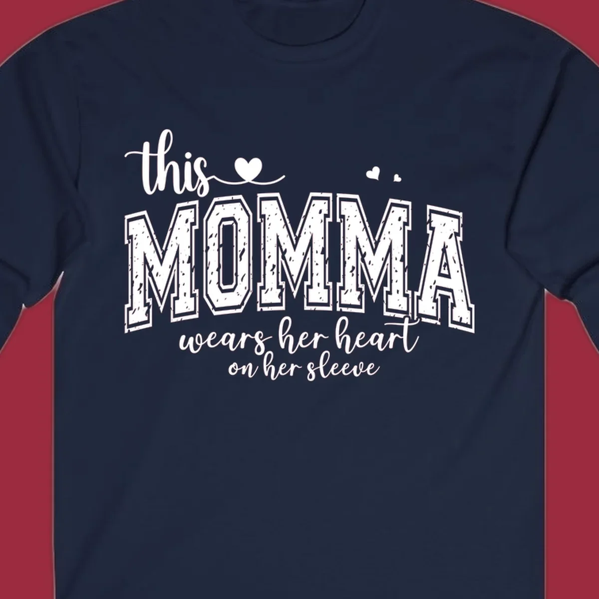 Momma heart on sleeve typography design with script and varsity text and heart icons.