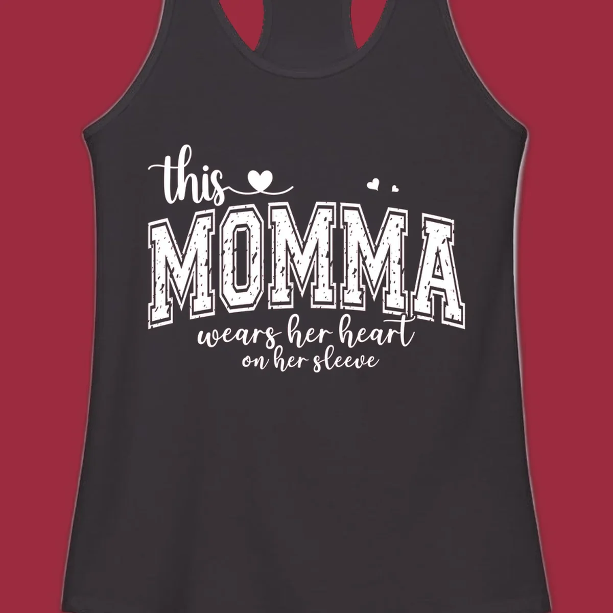 Momma heart on sleeve typography design with script and varsity text and heart icons.
