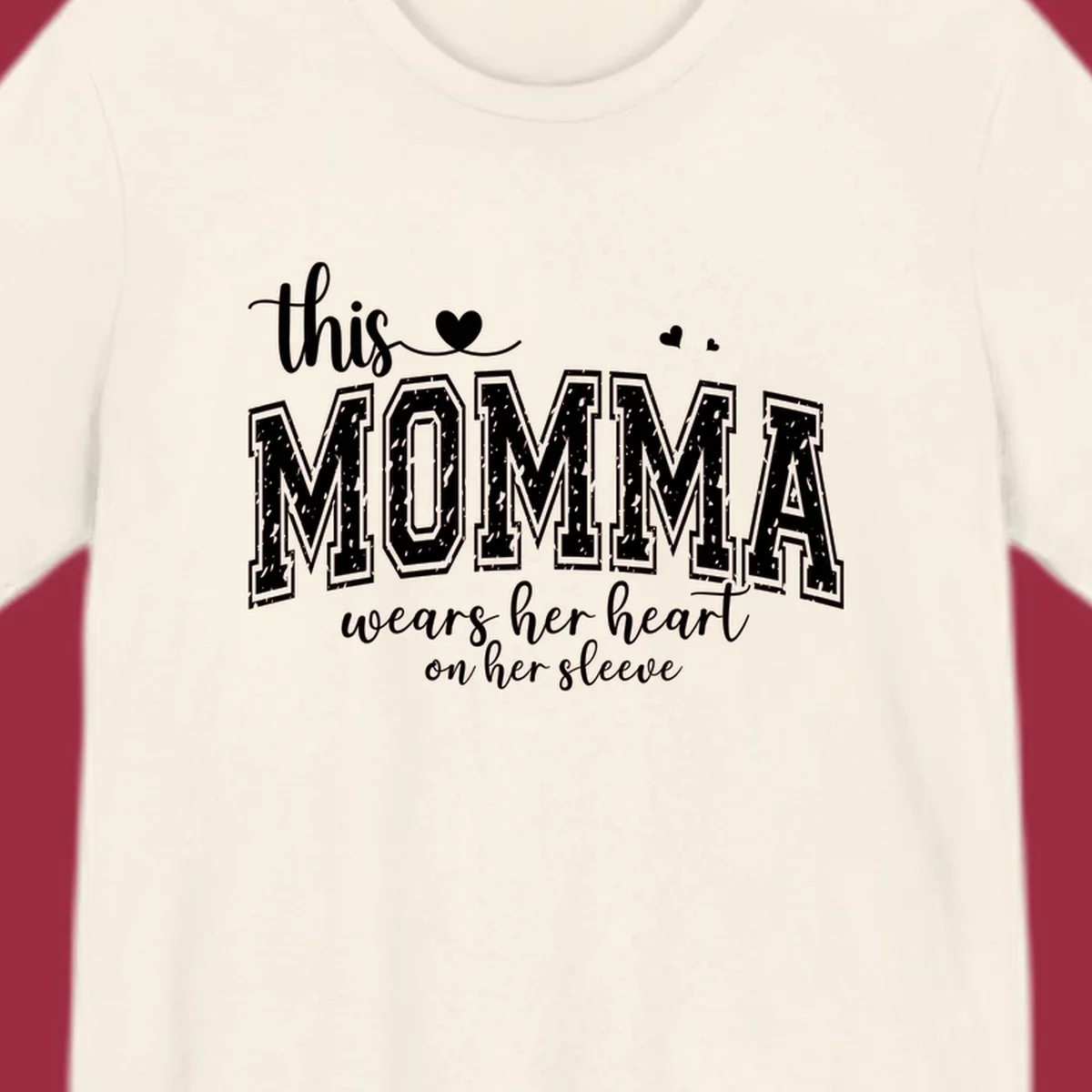 Momma heart on sleeve typography design with script and varsity text and heart icons.