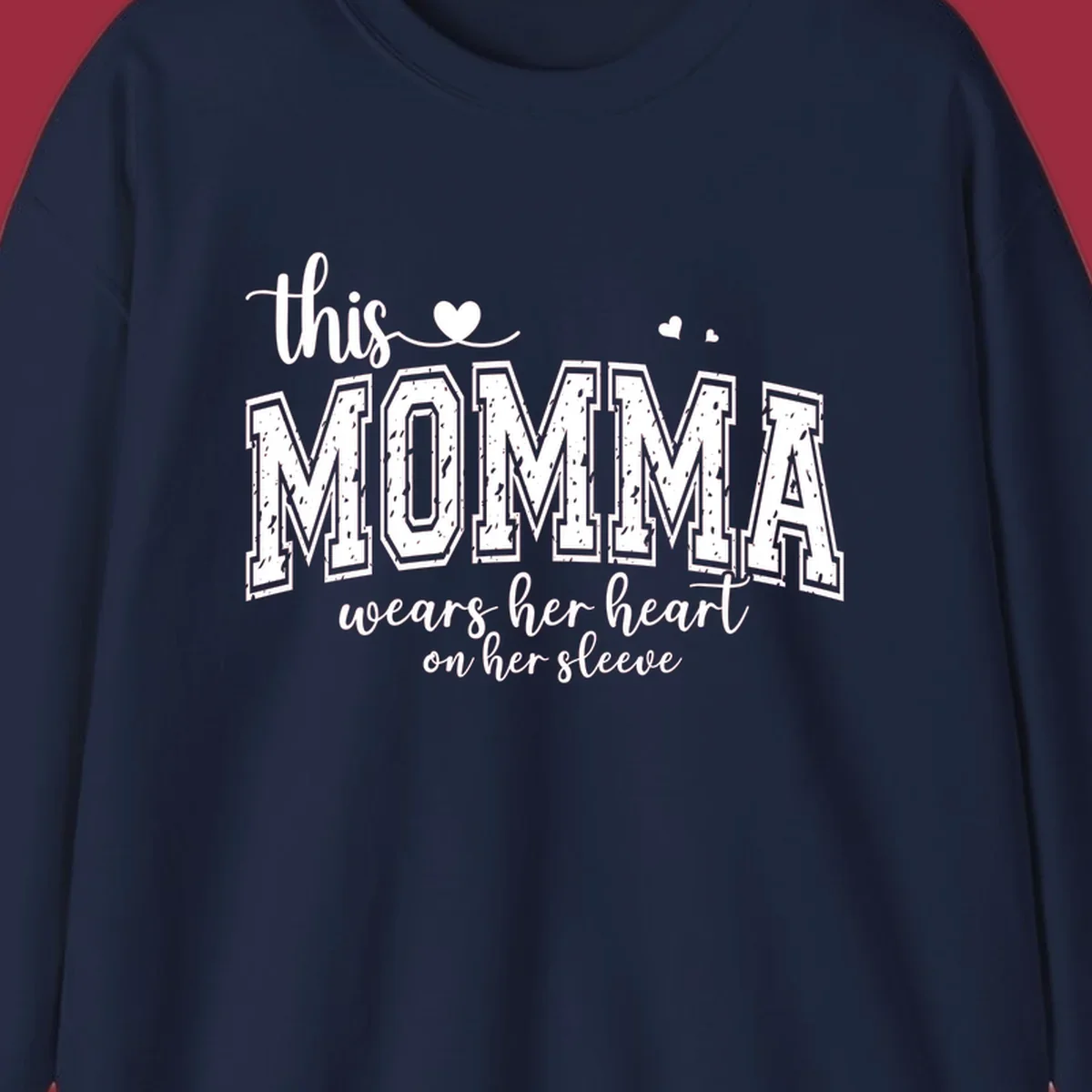 Momma heart on sleeve typography design with script and varsity text and heart icons.
