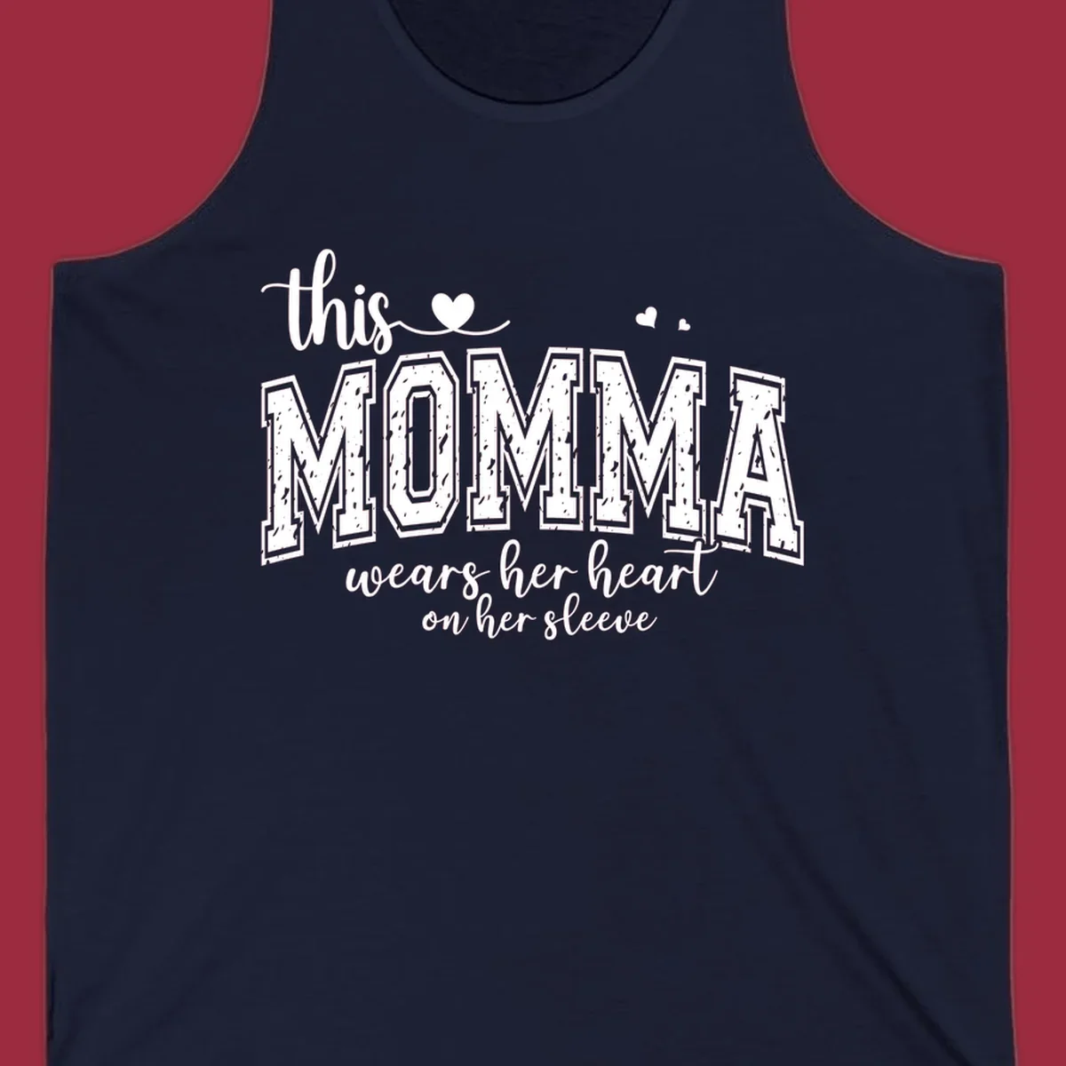 Momma heart on sleeve typography design with script and varsity text and heart icons.