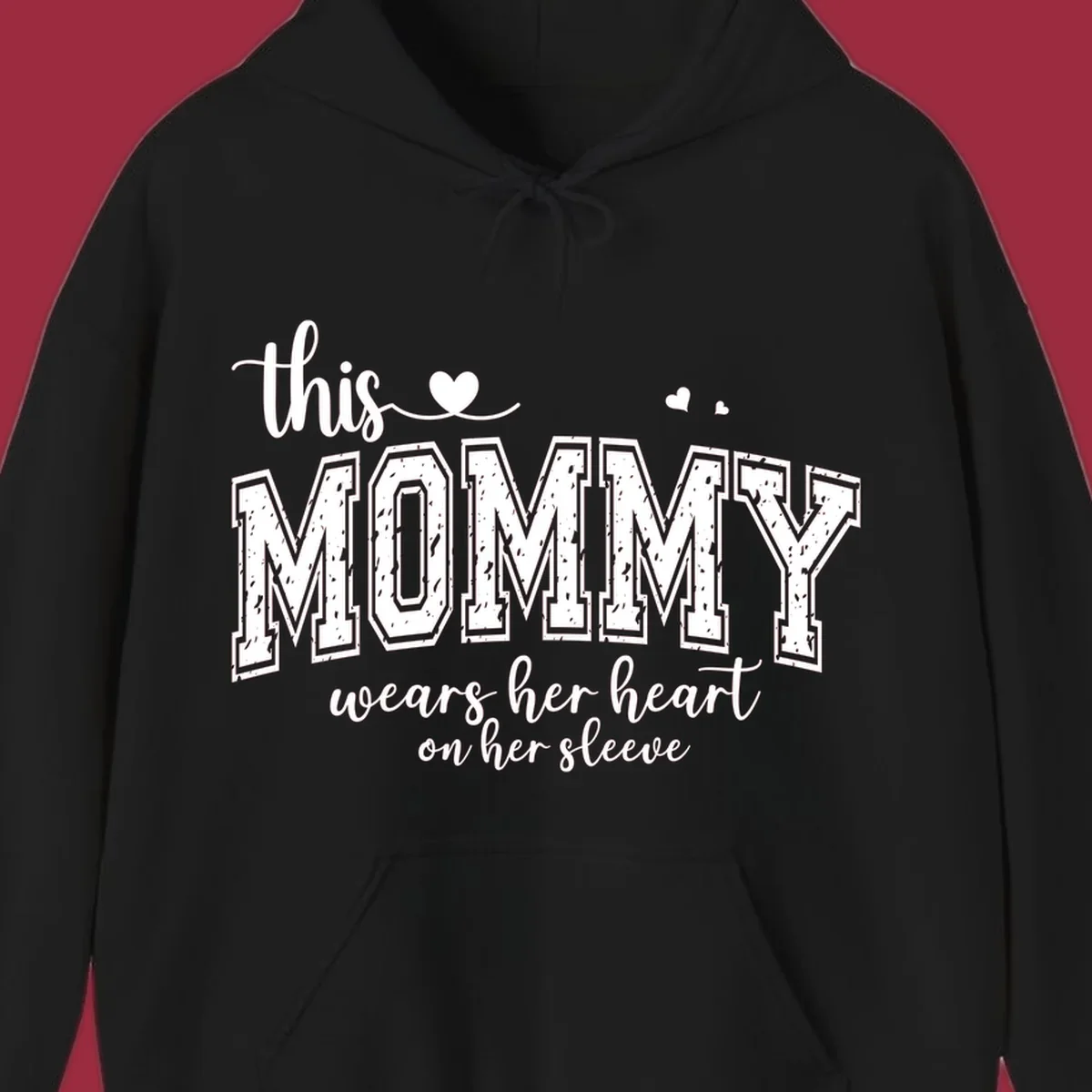 This Mommy Wears Her Heart On Her Sleeve text design with hearts.