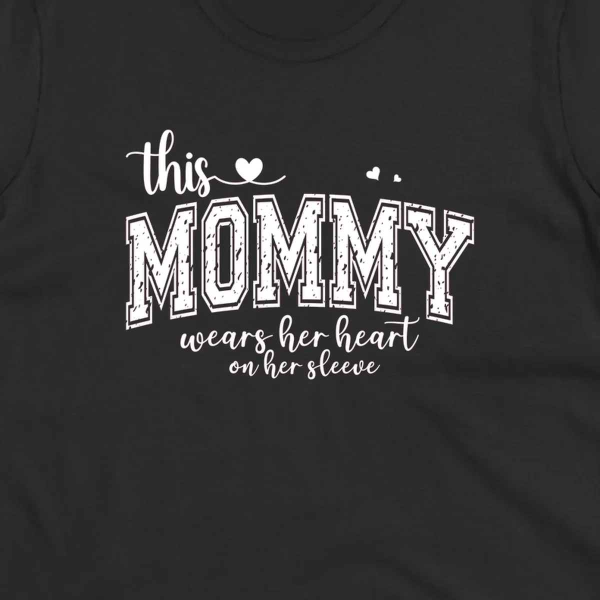 This Mommy Wears Her Heart On Her Sleeve text design with hearts.