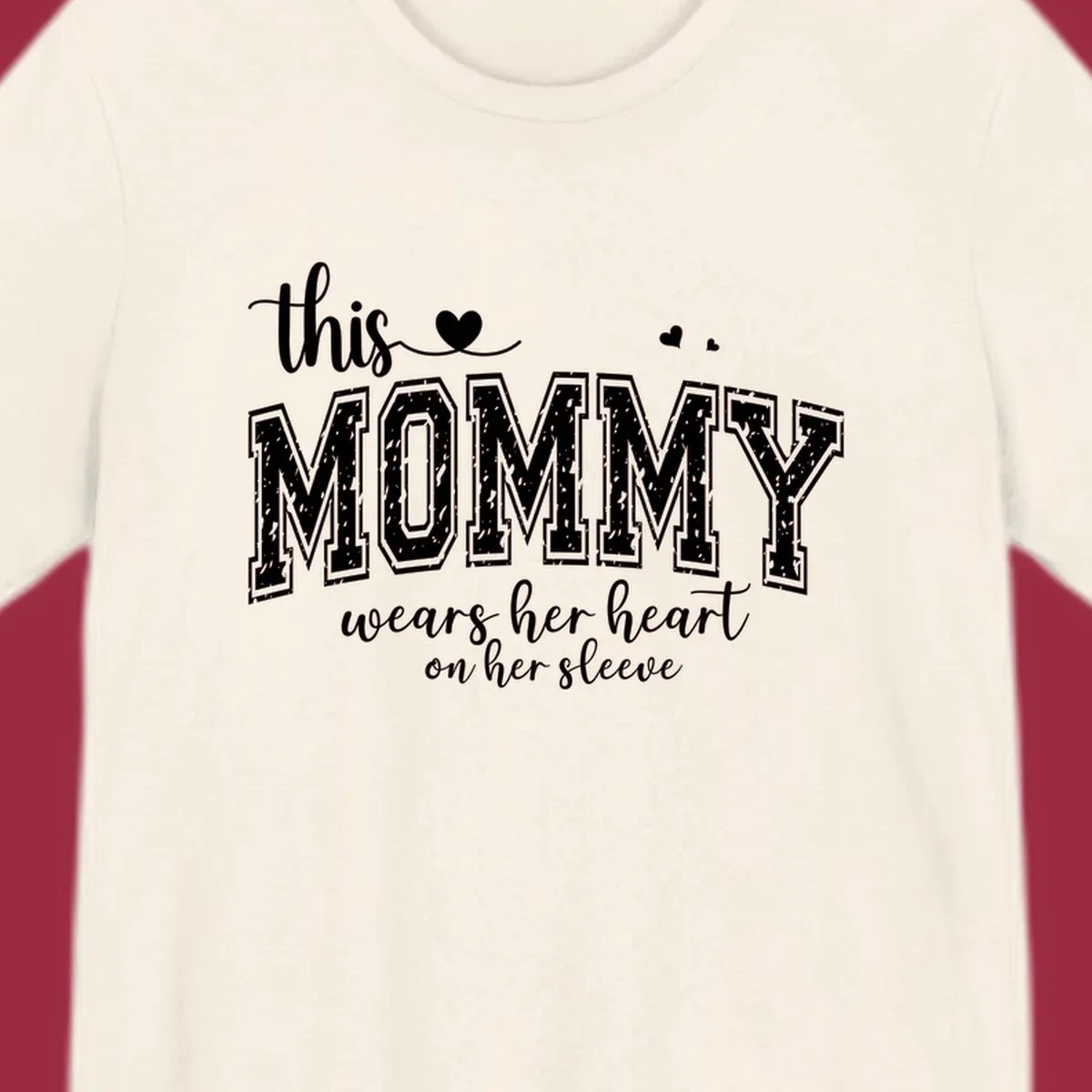 This Mommy Wears Her Heart On Her Sleeve text design with hearts.