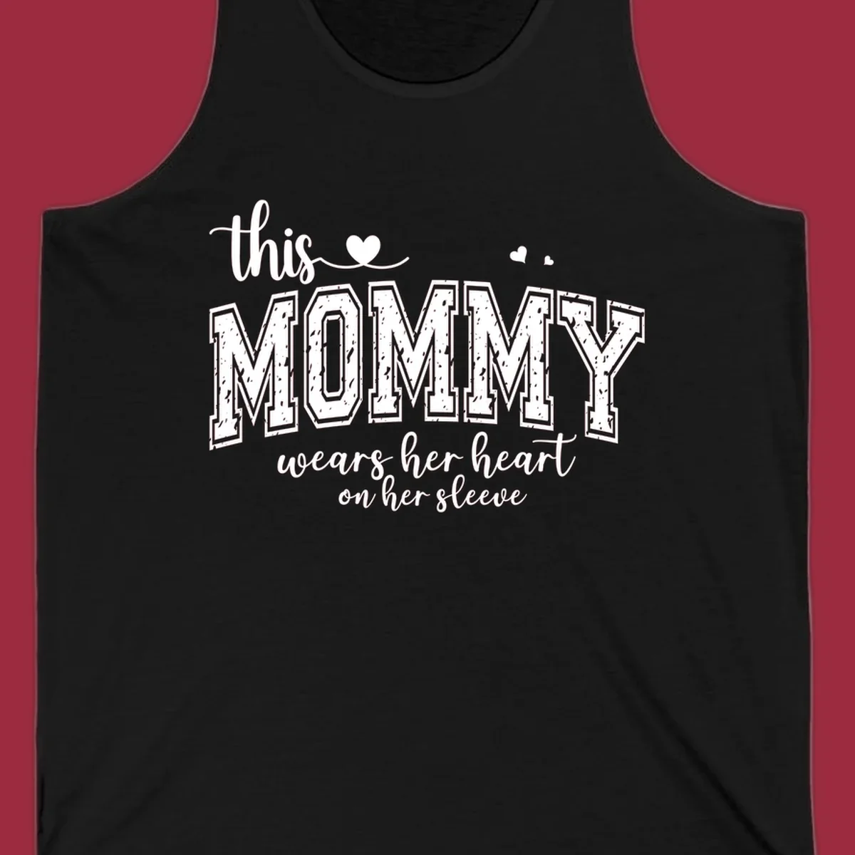 This Mommy Wears Her Heart On Her Sleeve text design with hearts.