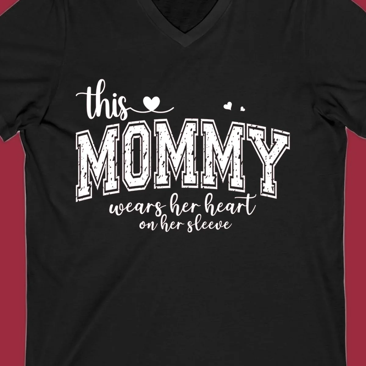 This Mommy Wears Her Heart On Her Sleeve text design with hearts.