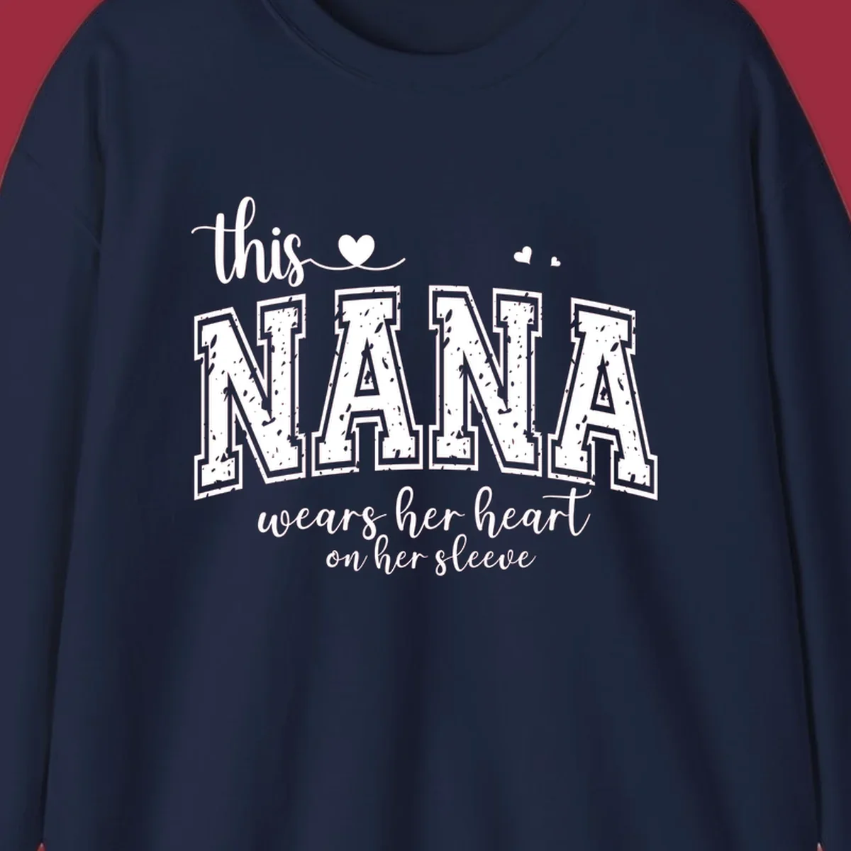 Text design for Nana that says 'this nana wears her heart on her sleeve' with heart accents.