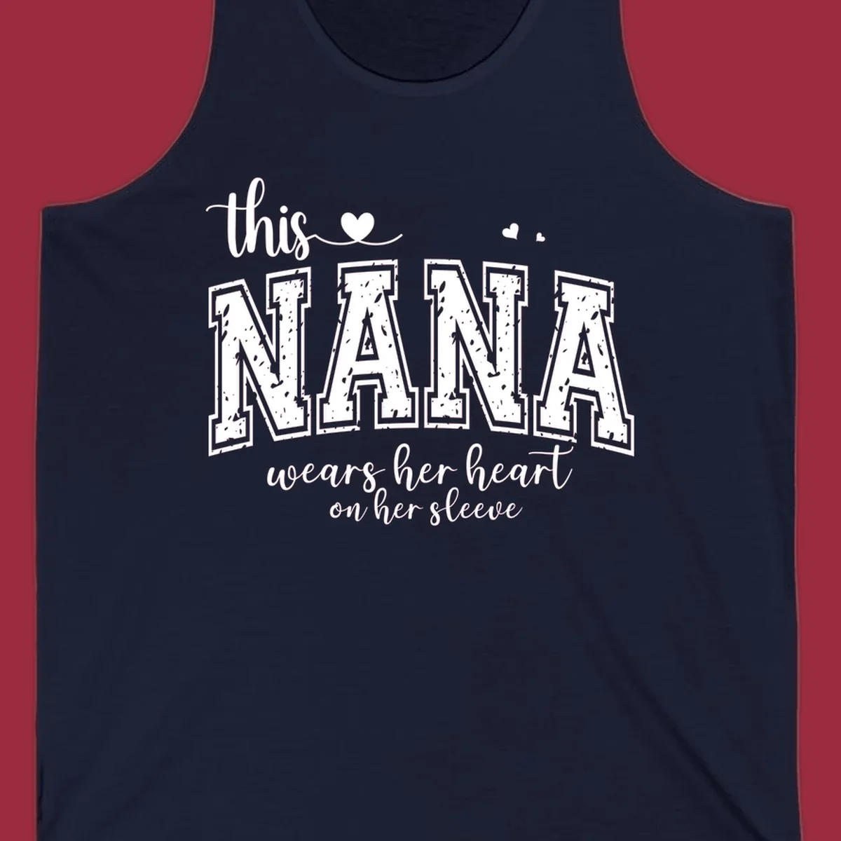 Text design for Nana that says 'this nana wears her heart on her sleeve' with heart accents.