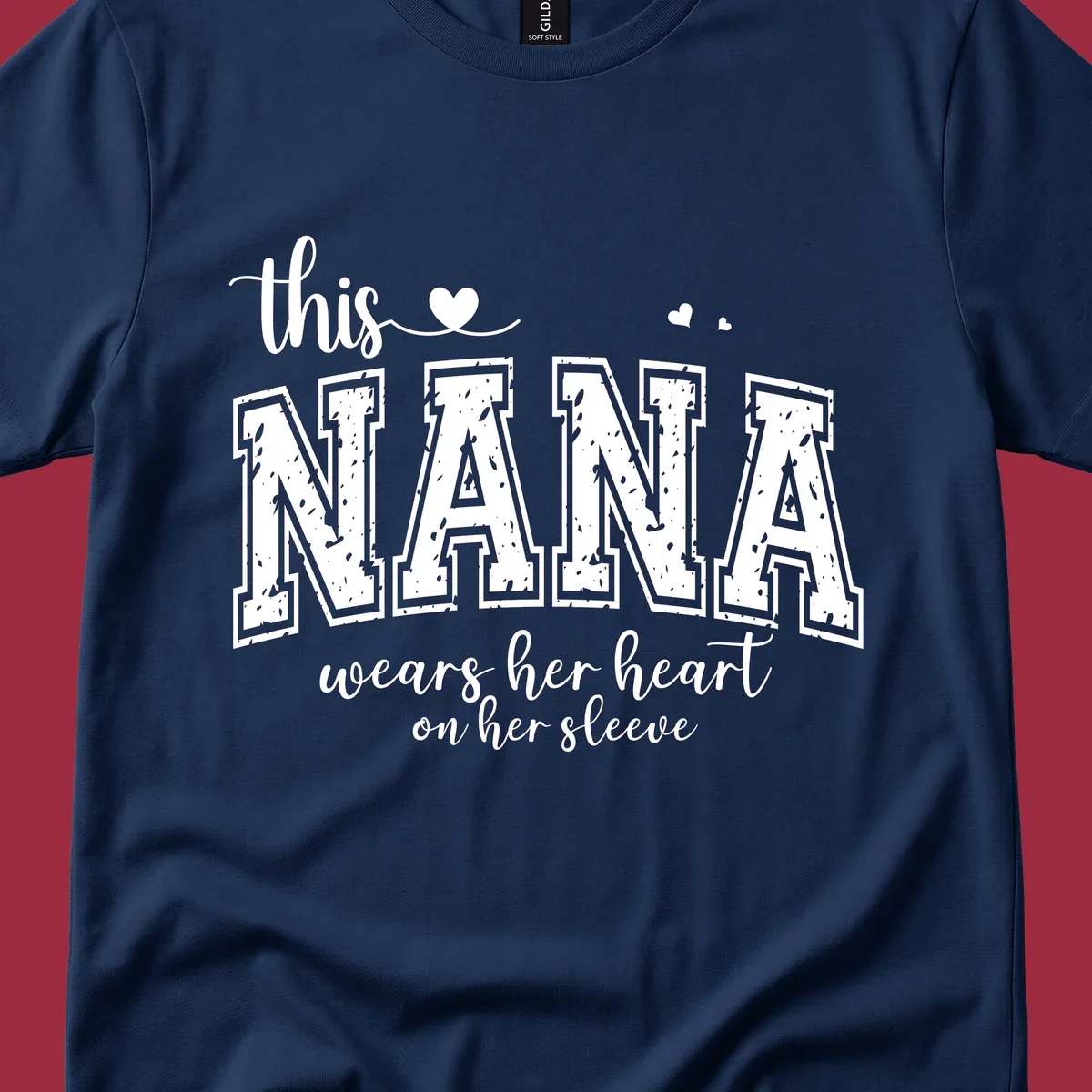Text design for Nana that says 'this nana wears her heart on her sleeve' with heart accents.