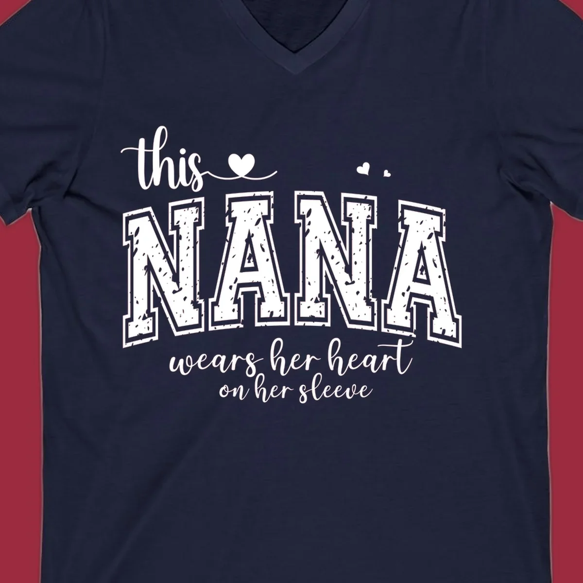Text design for Nana that says 'this nana wears her heart on her sleeve' with heart accents.