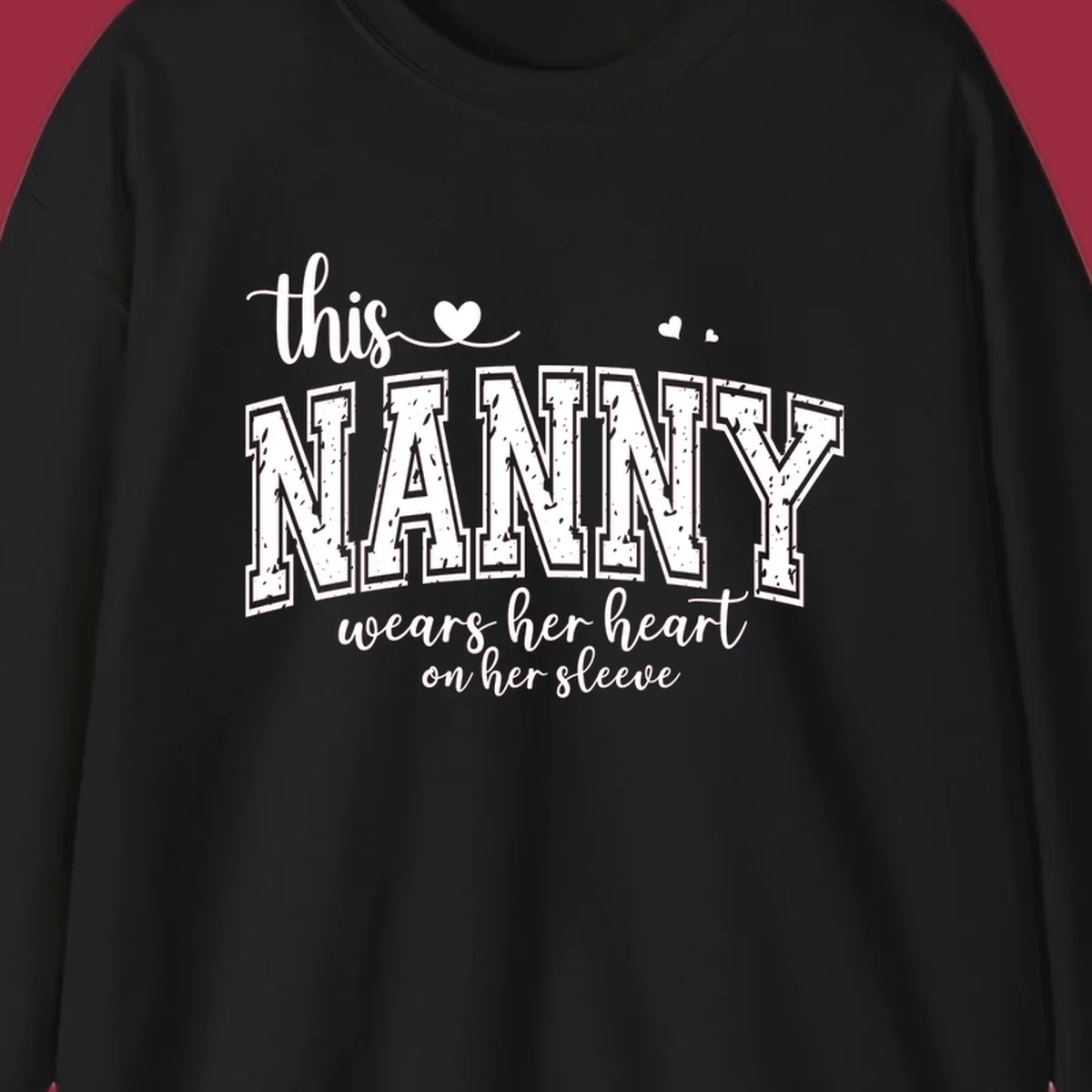 This Nanny Wears Her Heart On Her Sleeve typography design with hearts.