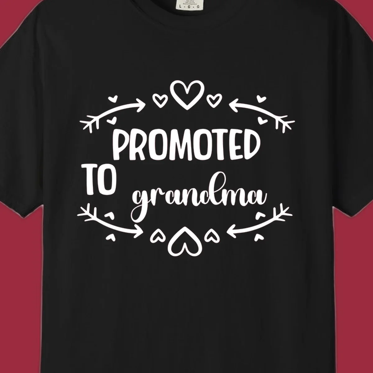 Promoted to Grandma text with hearts and arrows graphic.