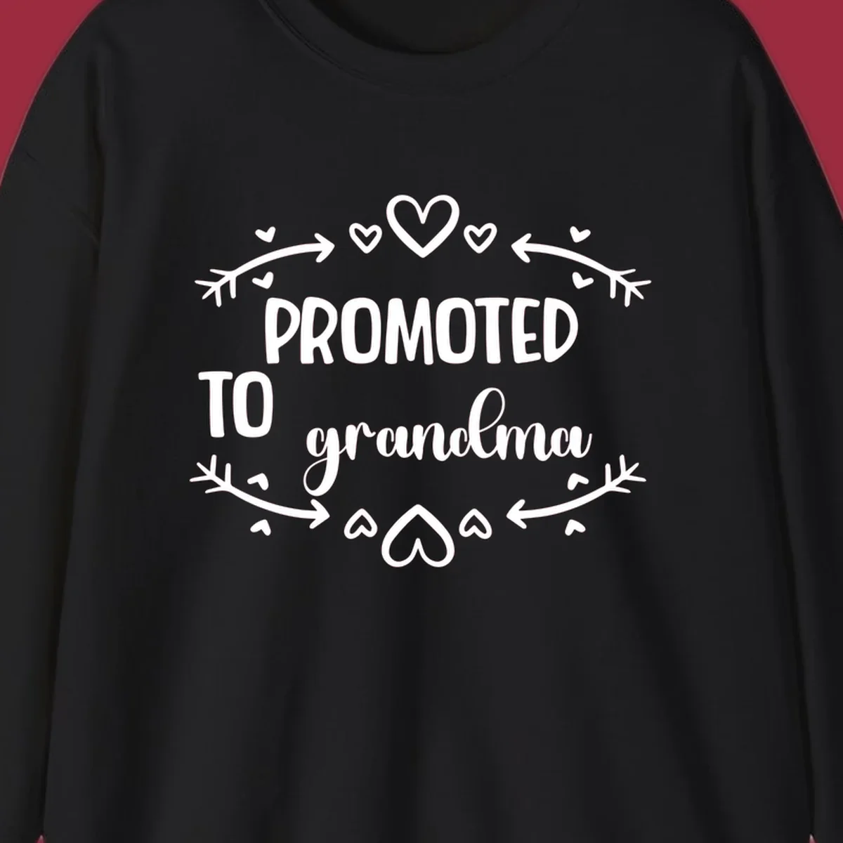 Promoted to Grandma text with hearts and arrows graphic.