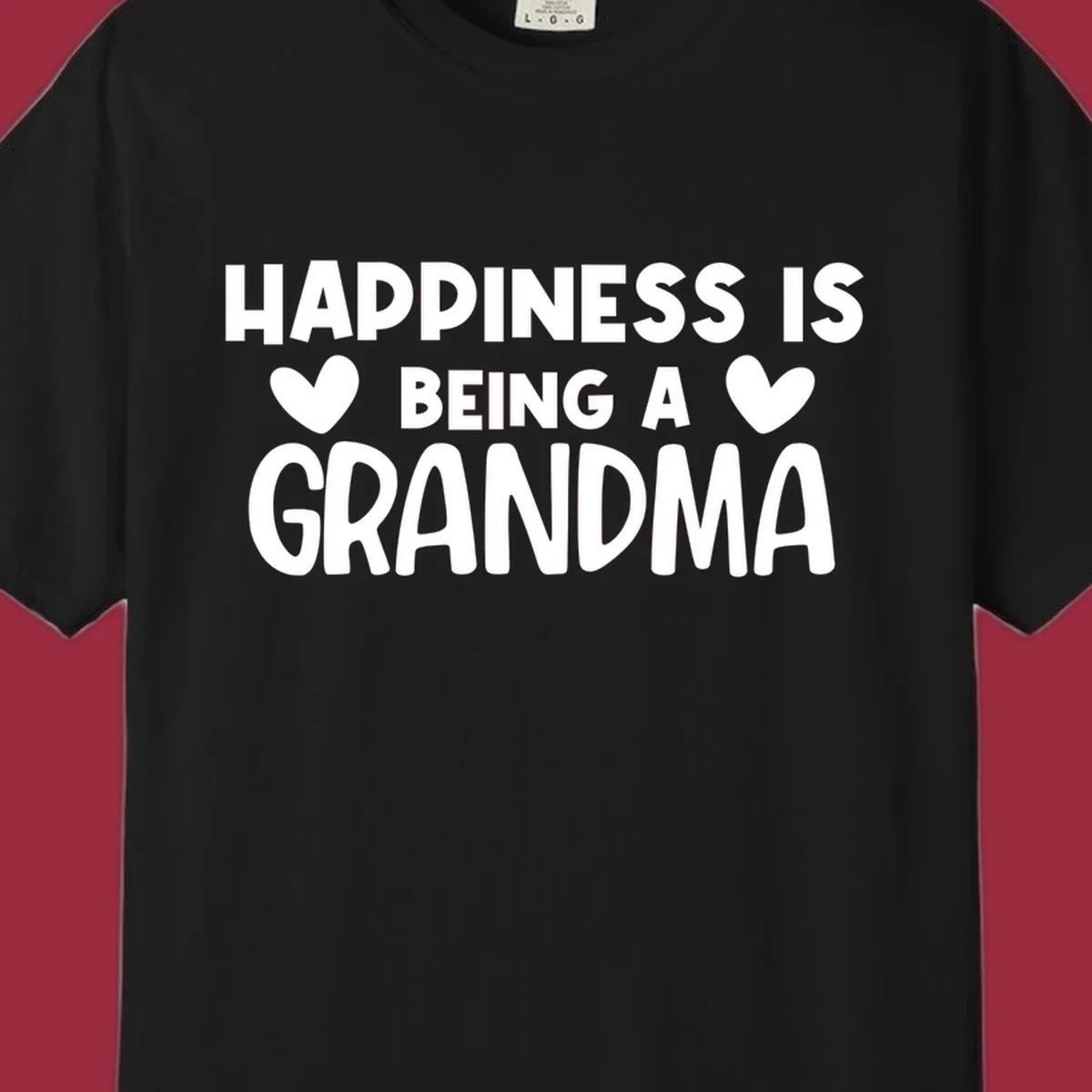 Happiness is being a grandma quote with heart graphics.