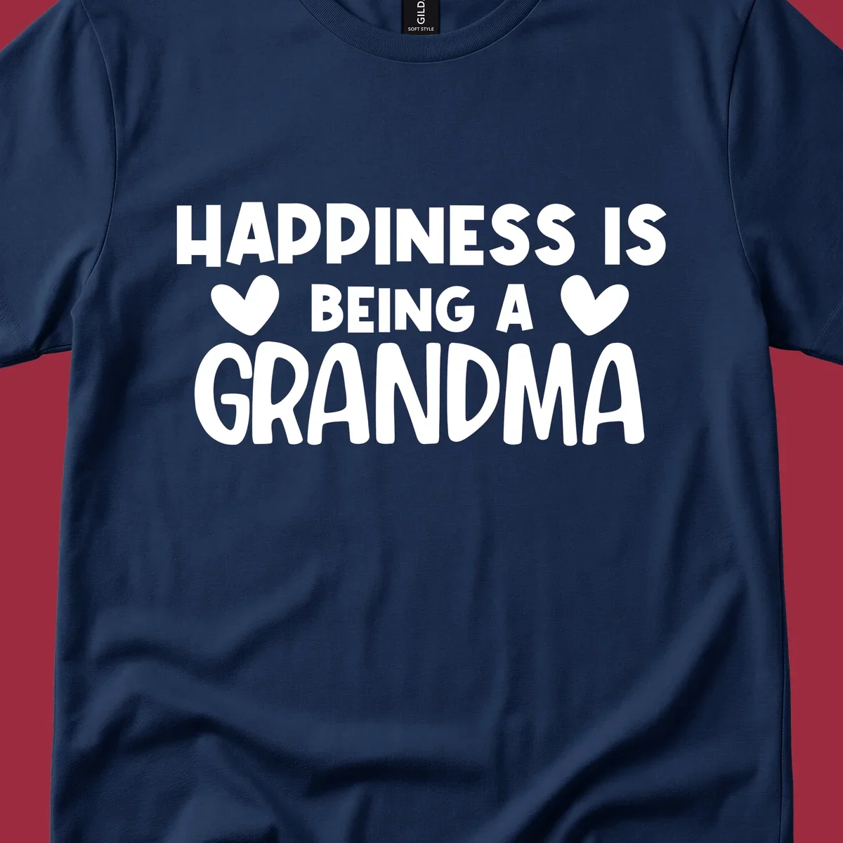Happiness is being a grandma quote with heart graphics.