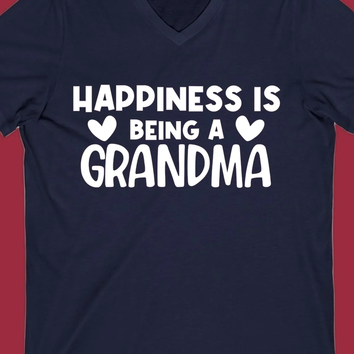 Happiness is being a grandma quote with heart graphics.