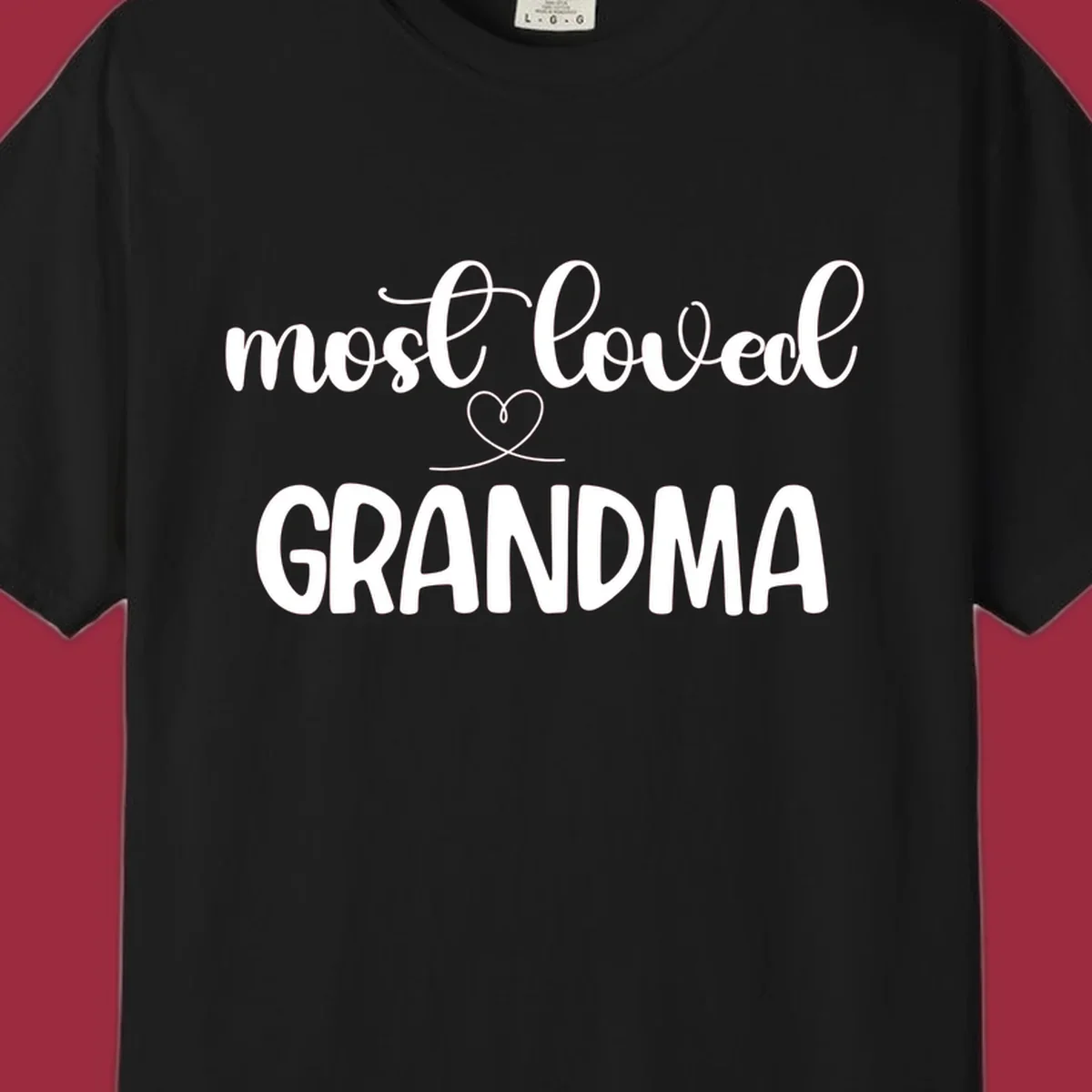 Most loved grandma typography design with a heart graphic.